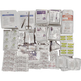 Collection of medical supplies including bandages and scissors on a white background