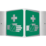 First aid station sign with green background and white symbols on a white background