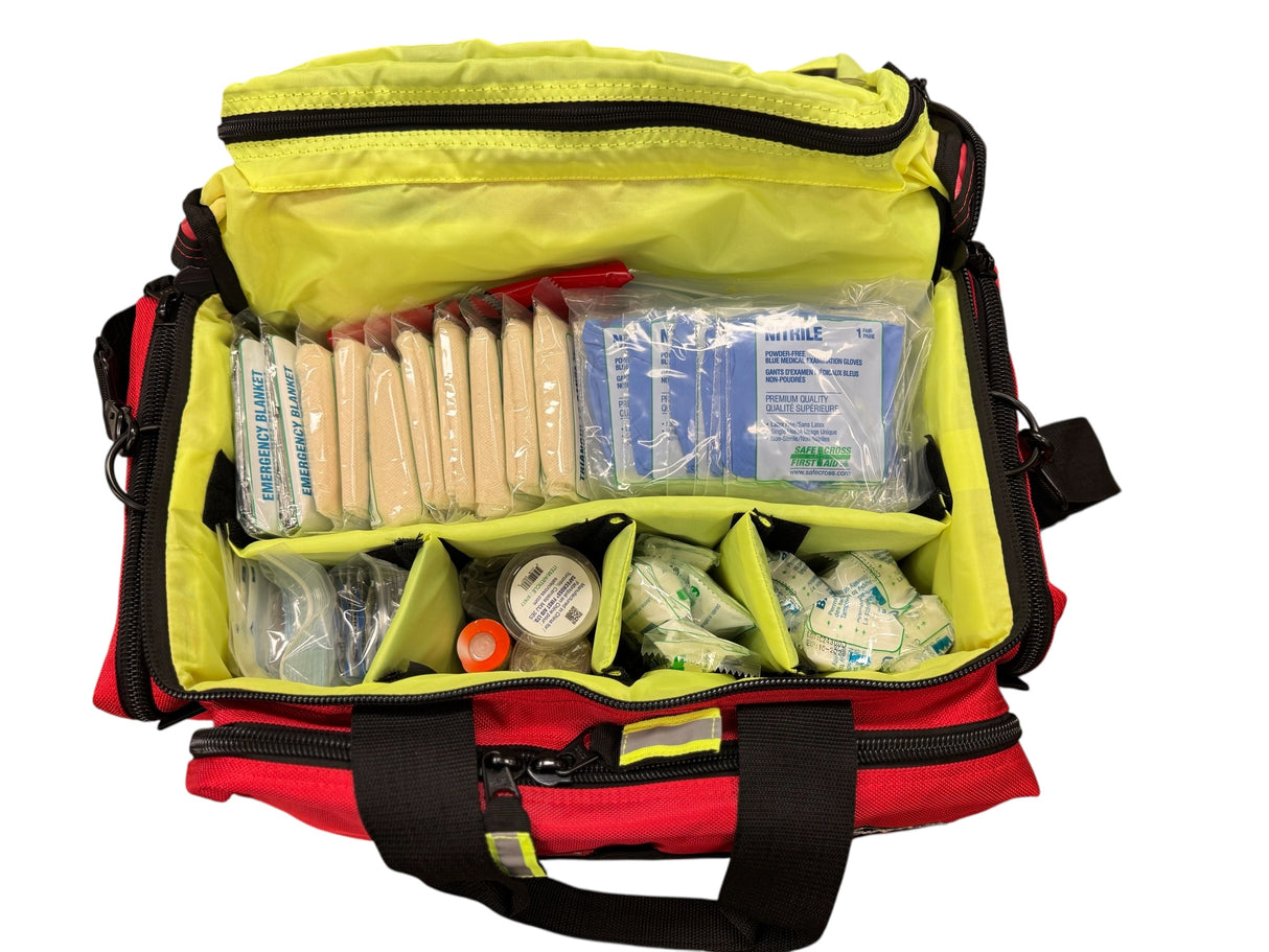 First aid kit with various supplies in a yellow and red bag on a white background