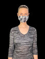 Soft satin face mask by SERVOXY INC with adjustable ear loops and smooth, shiny fabric for comfortable wear.